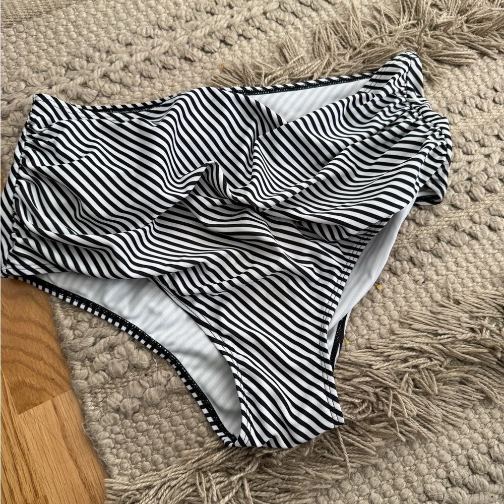 Black and White Striped High-Waisted Bikini Bottom with flowy peach tanks top.